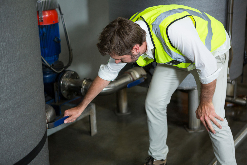 A man working in the filteration plant.